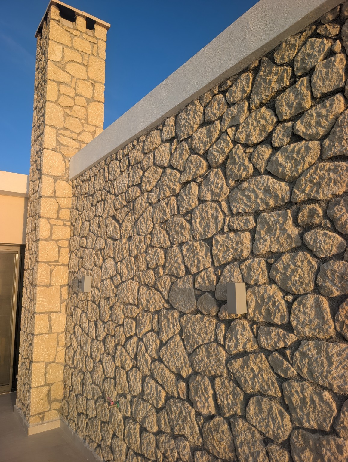 Sunset light on Villa Norma stonework