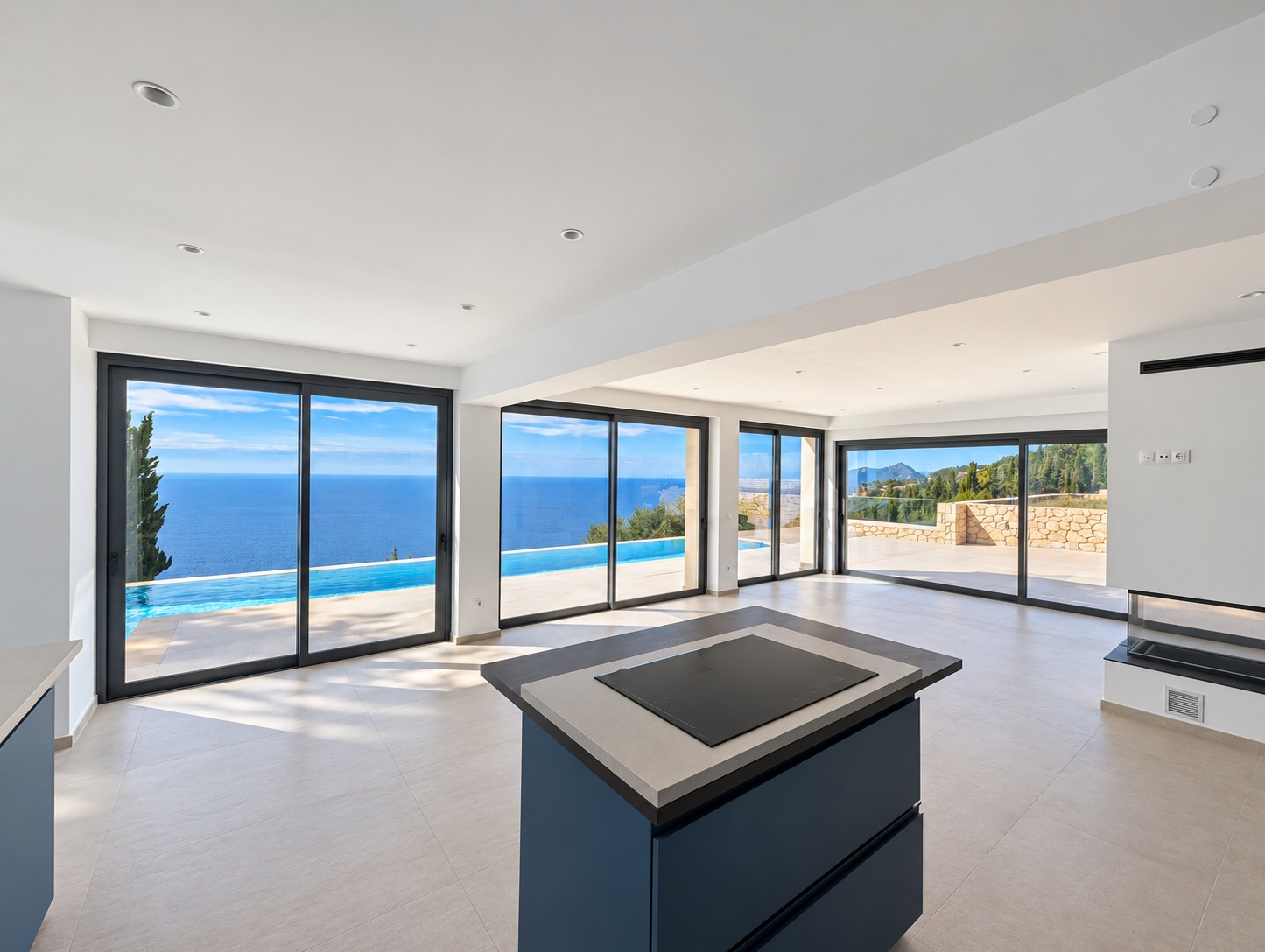 Cleaned current photograph of Villa Norma’s kitchen and lounge opening onto the pool and sea view