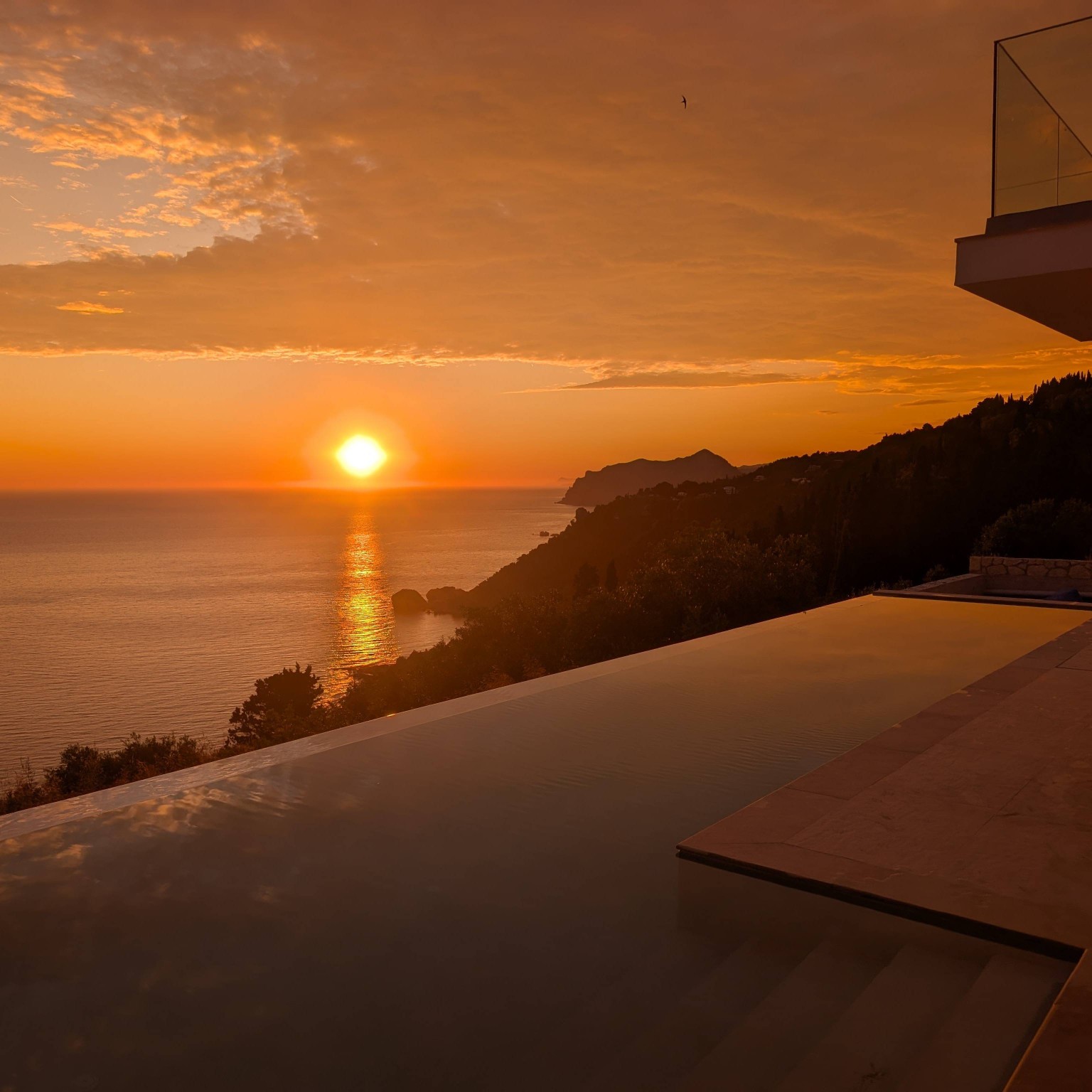 Golden sunset over the Villa Norma infinity pool